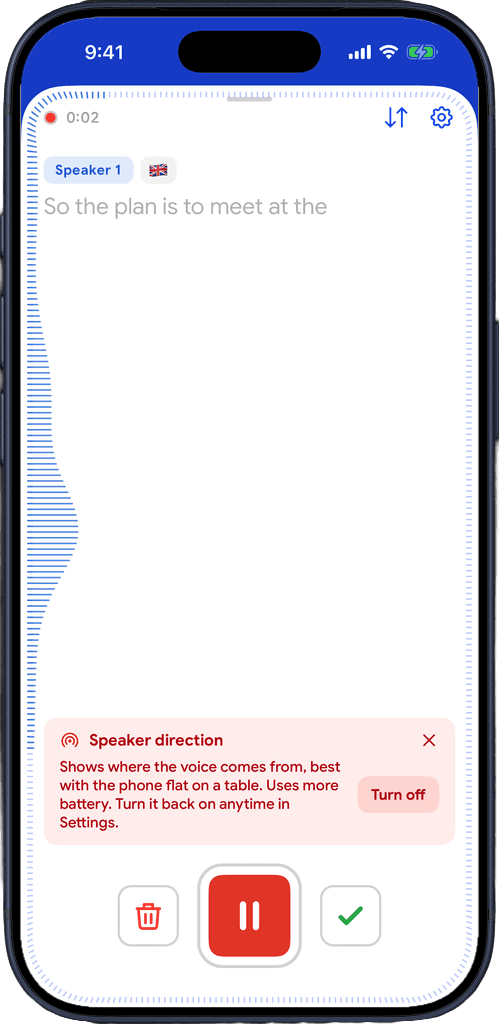 Live captions starting with the Speaker direction notice: best with the phone flat on a table